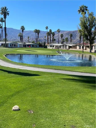 a view of a park with houses