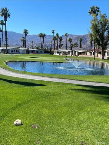 a view of a park with houses