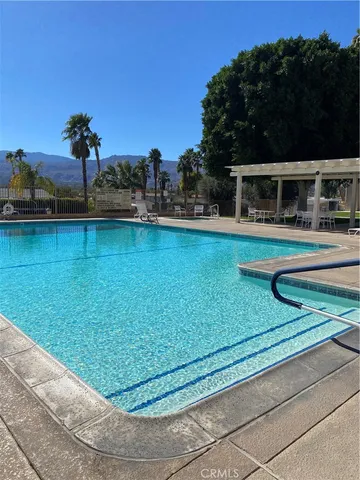 a view of a swimming pool with a garden