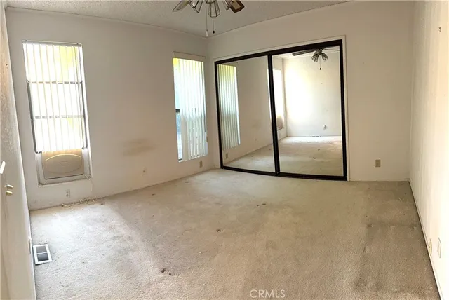 a view of a room with large windows