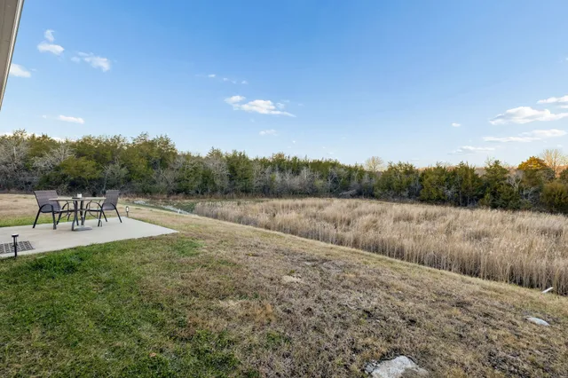 a view of a lake with a yard