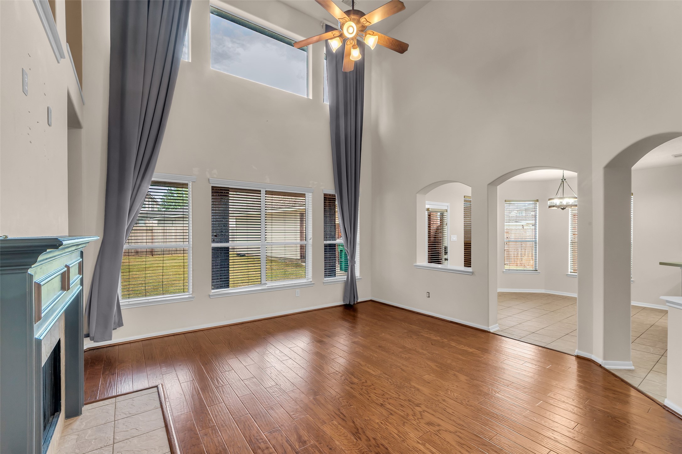 24823 Corbin Gate Drive Spring, TX 77389 - Photo 13 of 25 a view of an empty room with wooden floor and a window