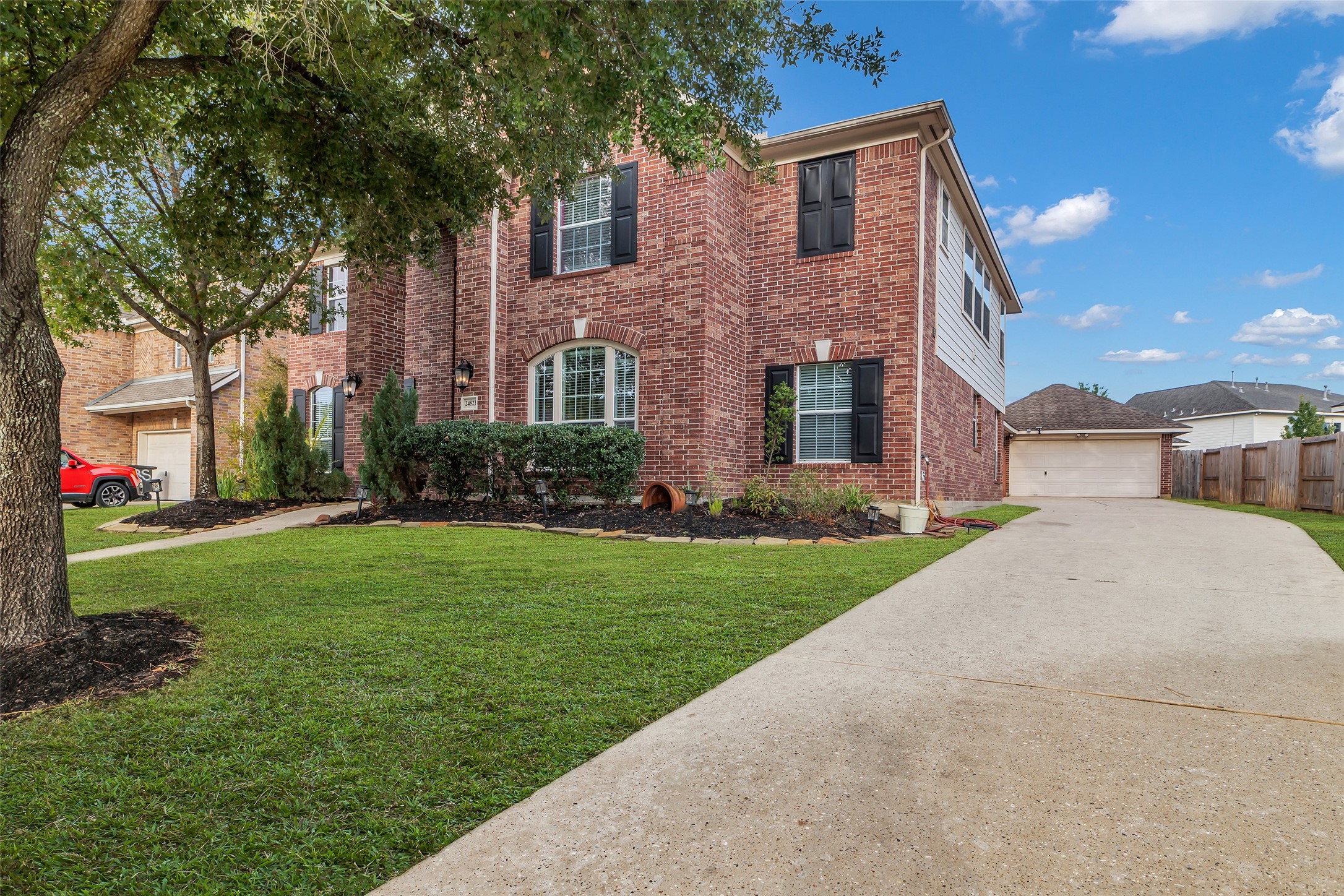 24823 Corbin Gate Drive Spring, TX 77389 - Photo 2 of 25 a front view of a house with garden