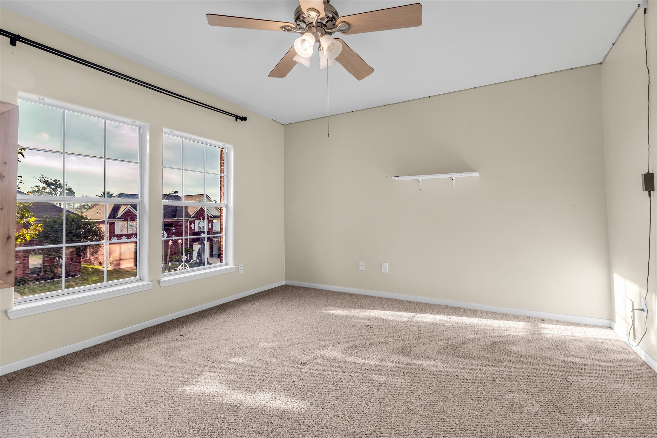 24823 Corbin Gate Drive Spring, TX 77389 - Photo 21 of 25 en empty room with windows and chandelier