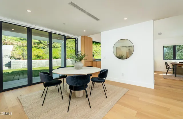 a view of a dining room with furniture window and outside view