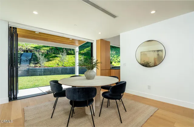 a view of a dining room with furniture window and outside view