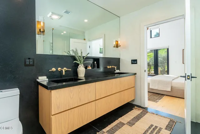 a kitchen with stainless steel appliances granite countertop a sink and a stove