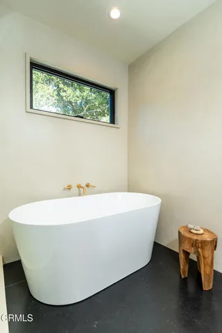 a bathroom with a mirror and a shower