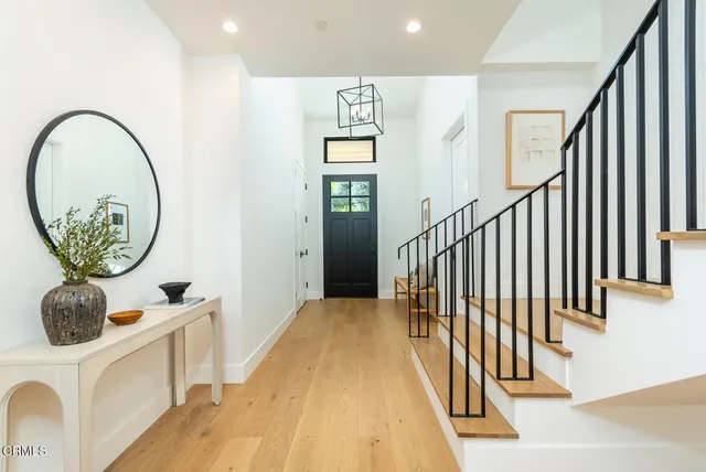 a view of entryway with wooden floor