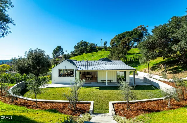 a view of a house with a big yard