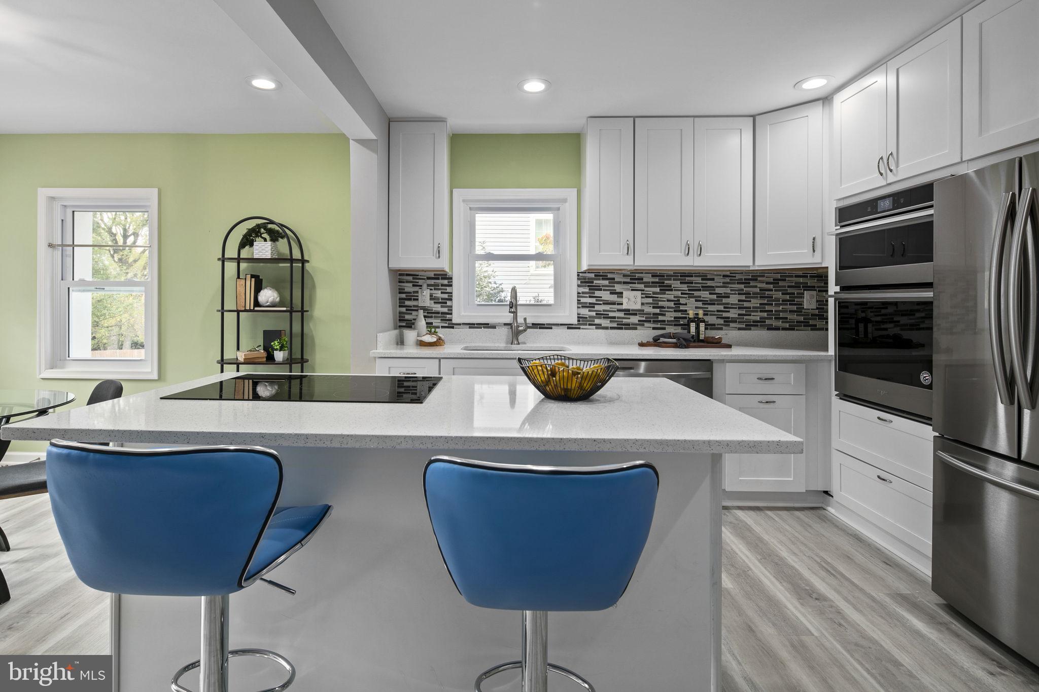 3424 Spring Drive Alexandria, VA 22306 - Photo 13 of 52 a kitchen with a sink a stove and chairs