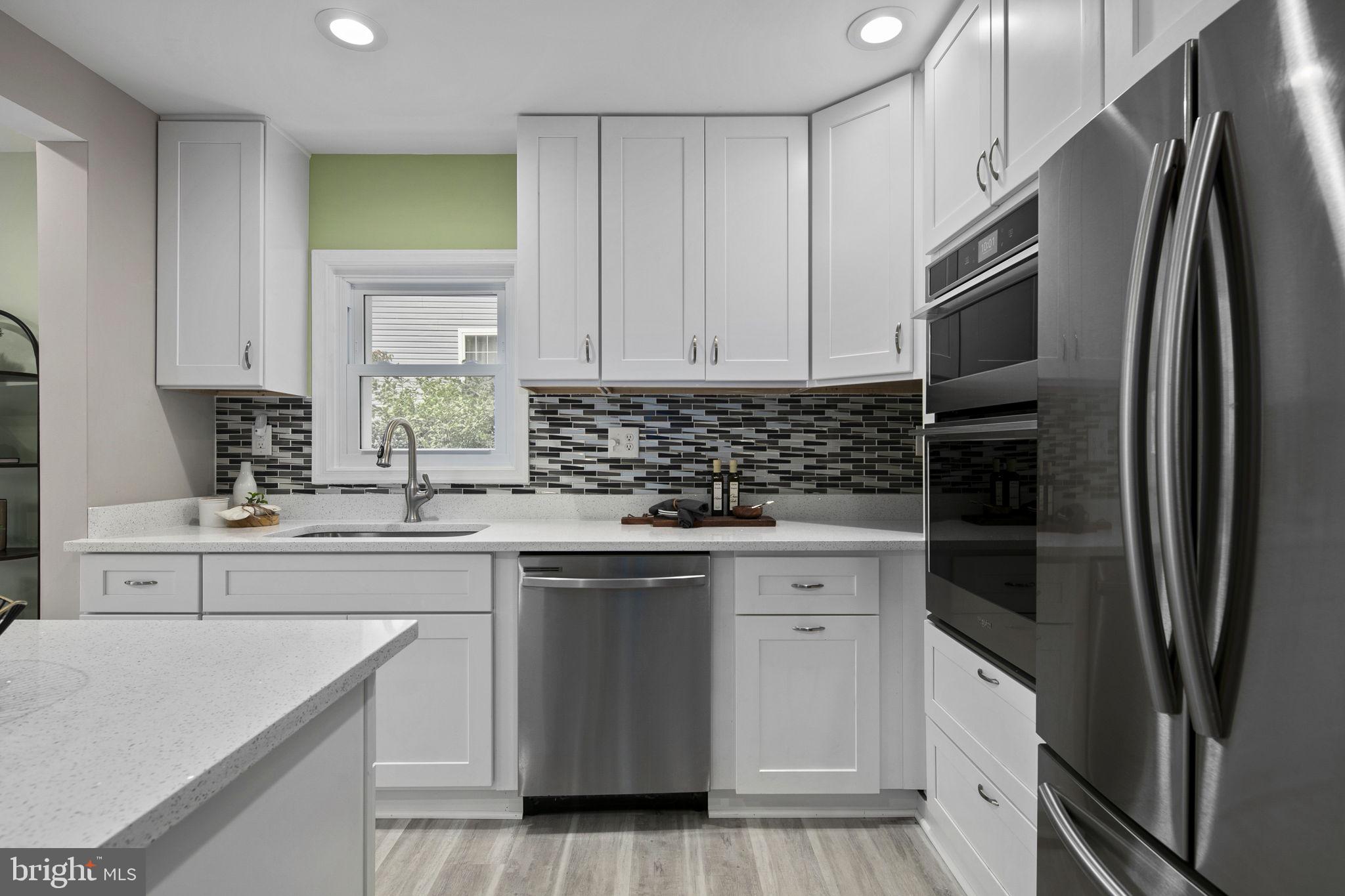 3424 Spring Drive Alexandria, VA 22306 - Photo 15 of 52 a kitchen with stainless steel appliances white cabinets and a sink
