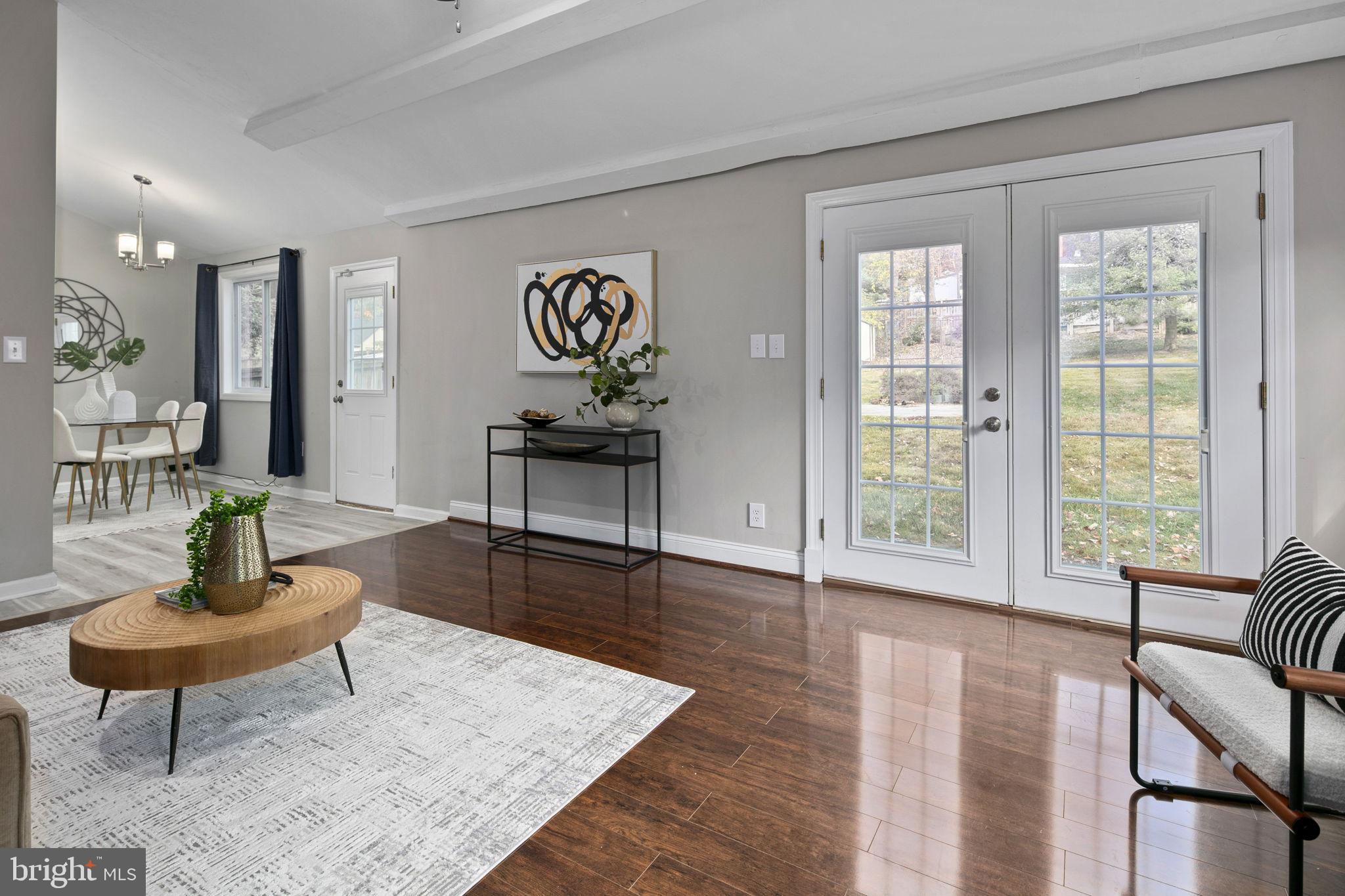 3424 Spring Drive Alexandria, VA 22306 - Photo 26 of 52 a living room with furniture and a wooden floor