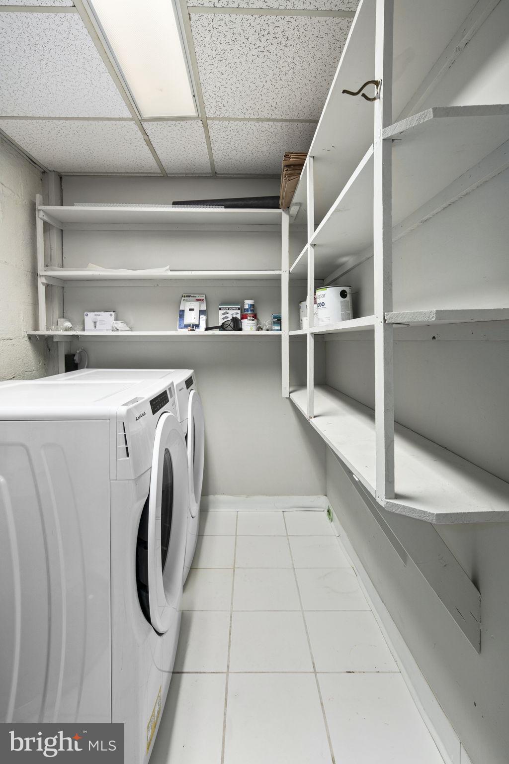 3424 Spring Drive Alexandria, VA 22306 - Photo 27 of 52 a view of washer and dryer with wooden racks