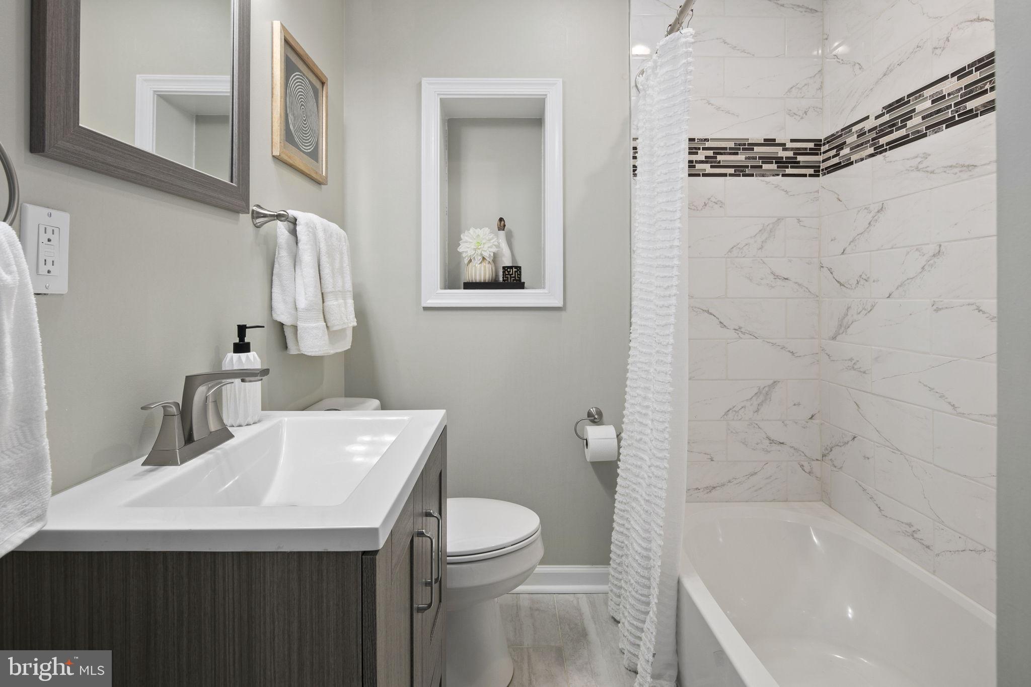 3424 Spring Drive Alexandria, VA 22306 - Photo 30 of 52 a bathroom with a sink a toilet and shower