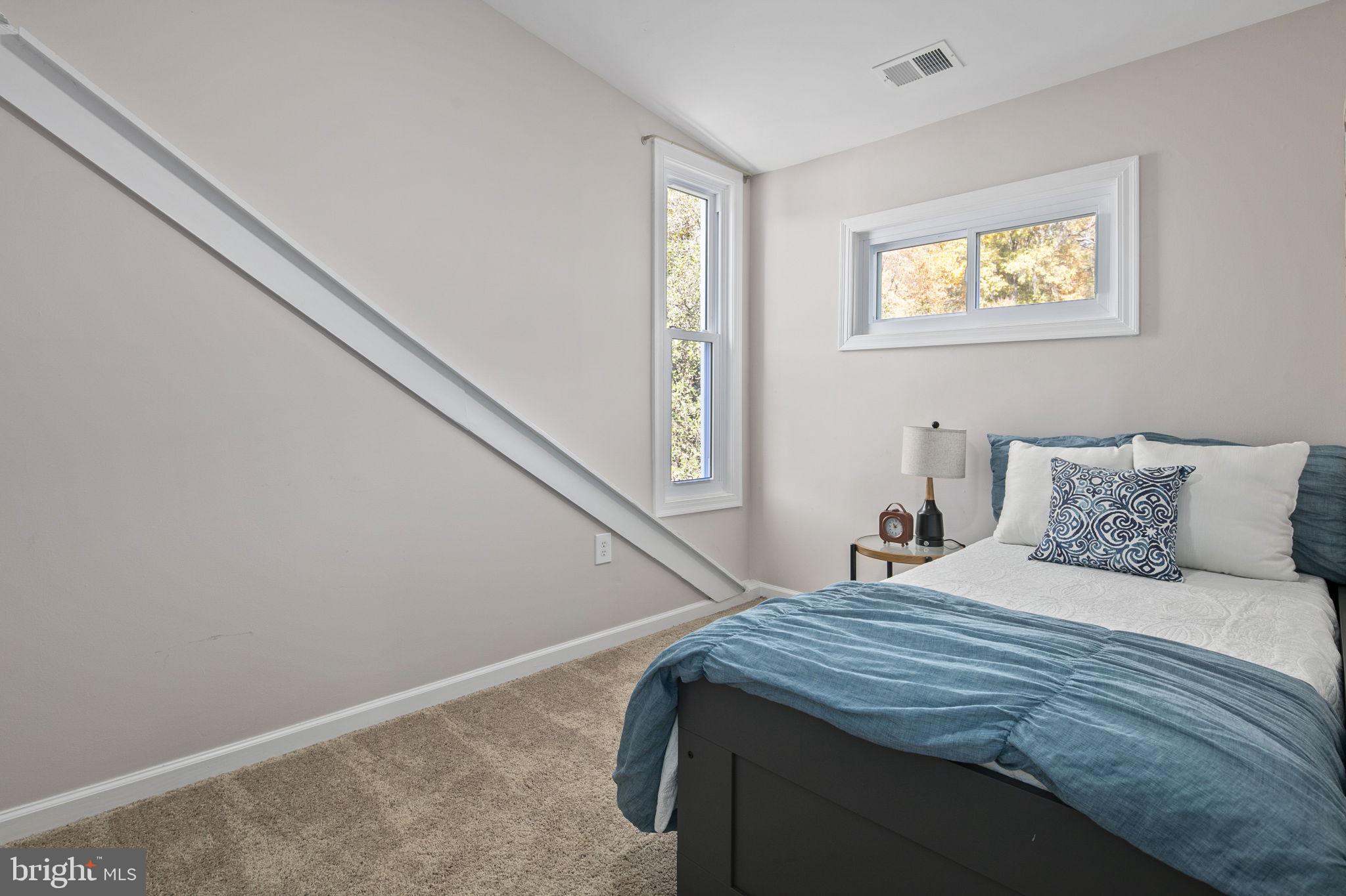 3424 Spring Drive Alexandria, VA 22306 - Photo 42 of 52 a bedroom with a bed and a window
