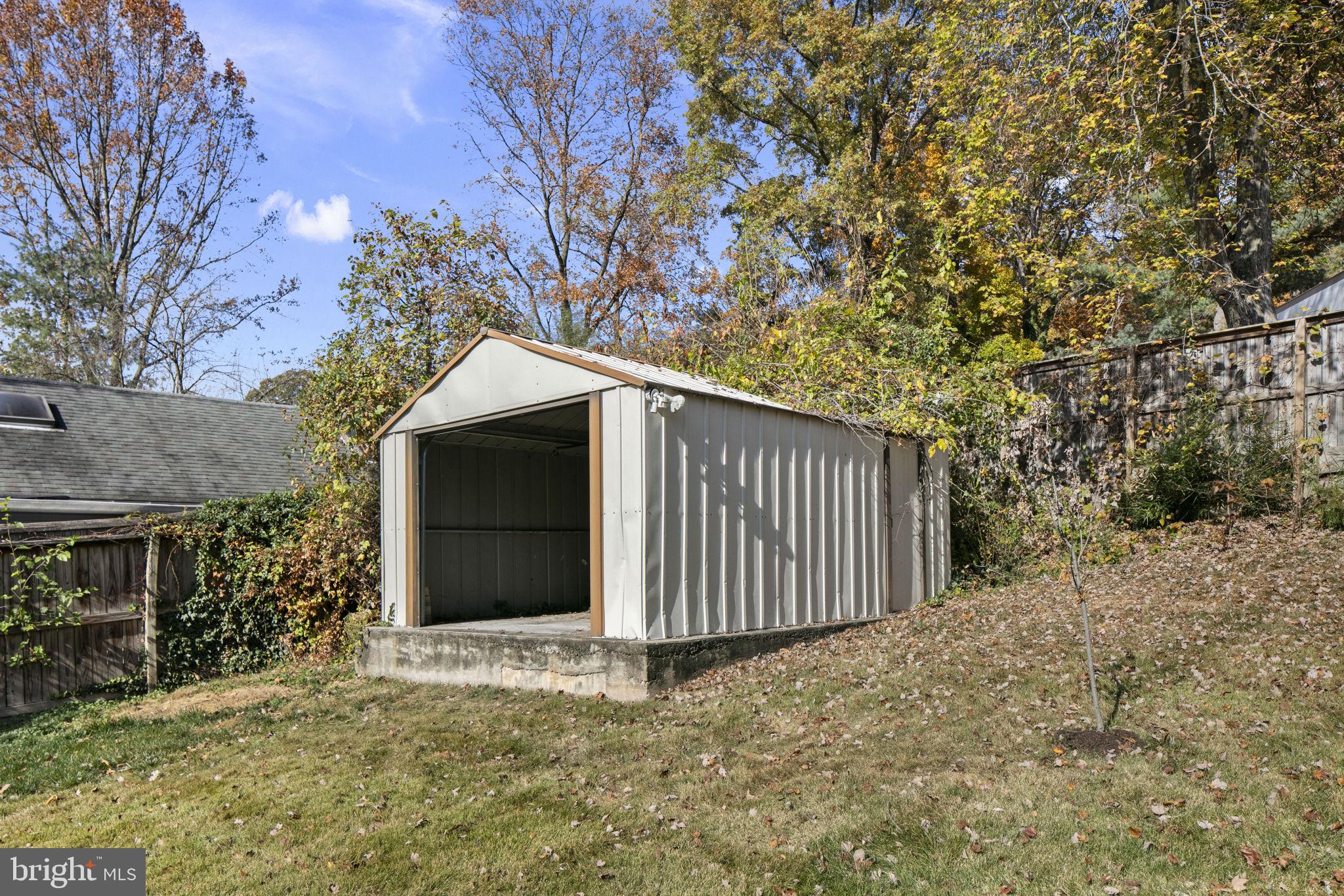3424 Spring Drive Alexandria, VA 22306 - Photo 48 of 52 a view of a house with a yard and garage