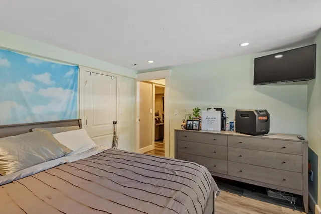 a bed room with a bed and a desk