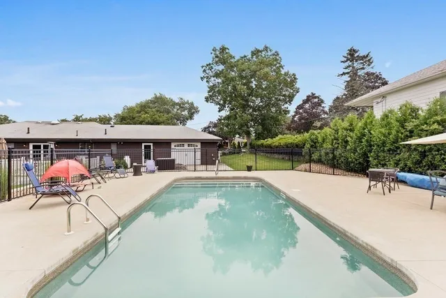 a bedroom with a bed and cabinets