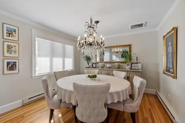 a kitchen that has a lot of cabinets in it and stainless steel appliances