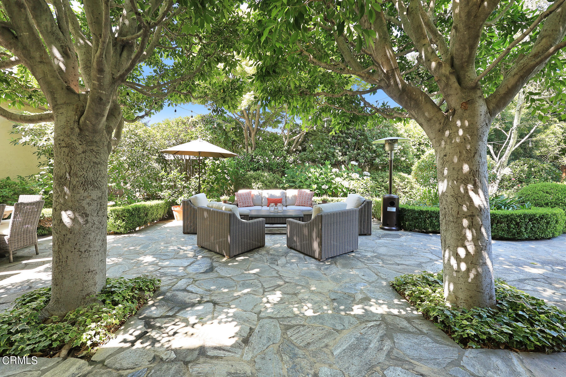 425 Prospect Circle South Pasadena, CA 91030 - Photo 15 of 19 a view of a patio with table and chairs and a large tree
