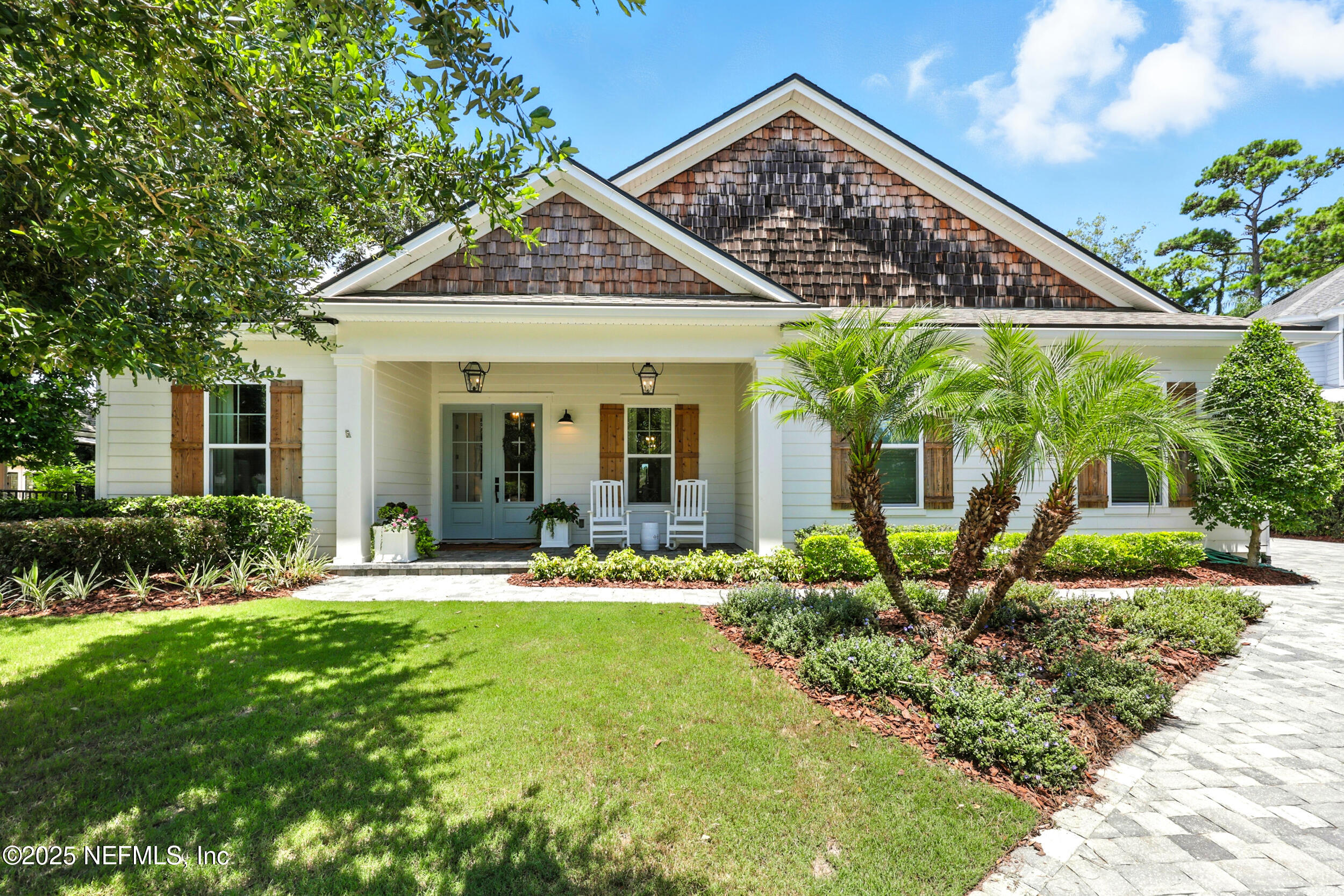 116 Palm Bay Court Ponte Vedra Beach, FL 32082 - Photo 1 of 60 a front view of a house with swimming pool and porch with furniture
