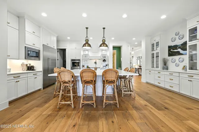 a kitchen with cabinets and steel stainless steel appliances