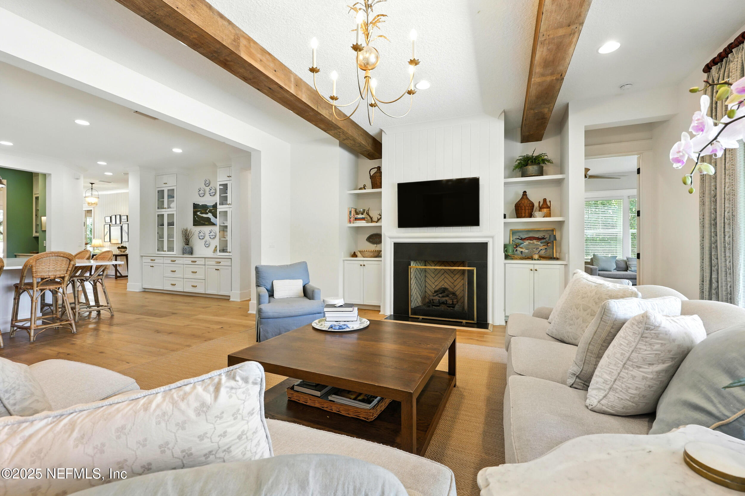 116 Palm Bay Court Ponte Vedra Beach, FL 32082 - Photo 19 of 60 a living room with furniture a flat screen tv and a fireplace