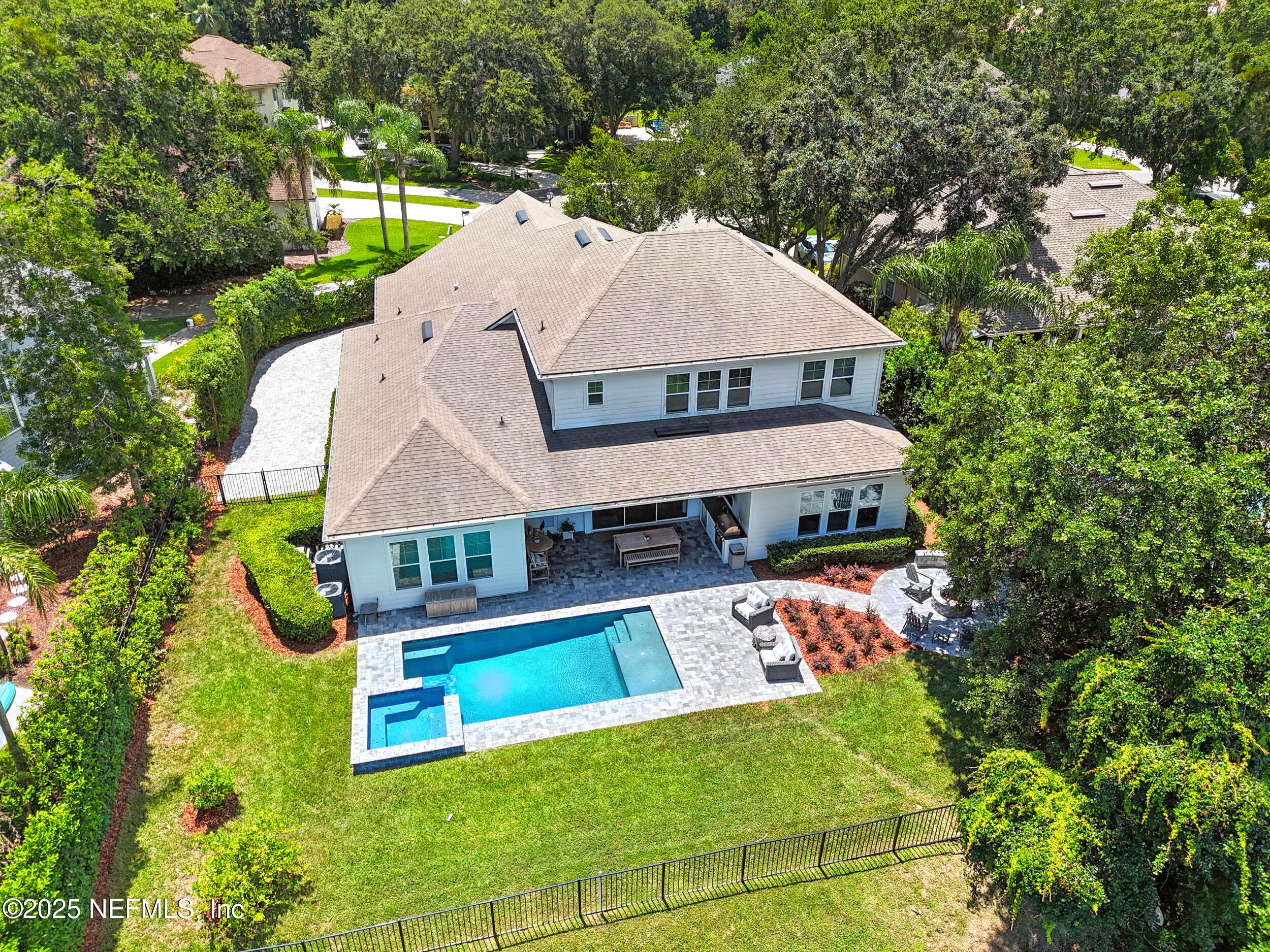 116 Palm Bay Court Ponte Vedra Beach, FL 32082 - Photo 2 of 60 an aerial view of a house with swimming pool and large trees