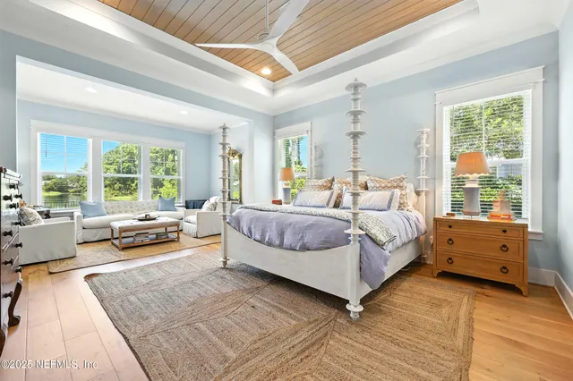 a bedroom with a bed and a mirror