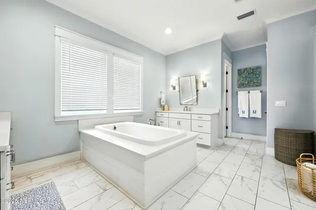 a bathroom with a toilet sink shower and mirror