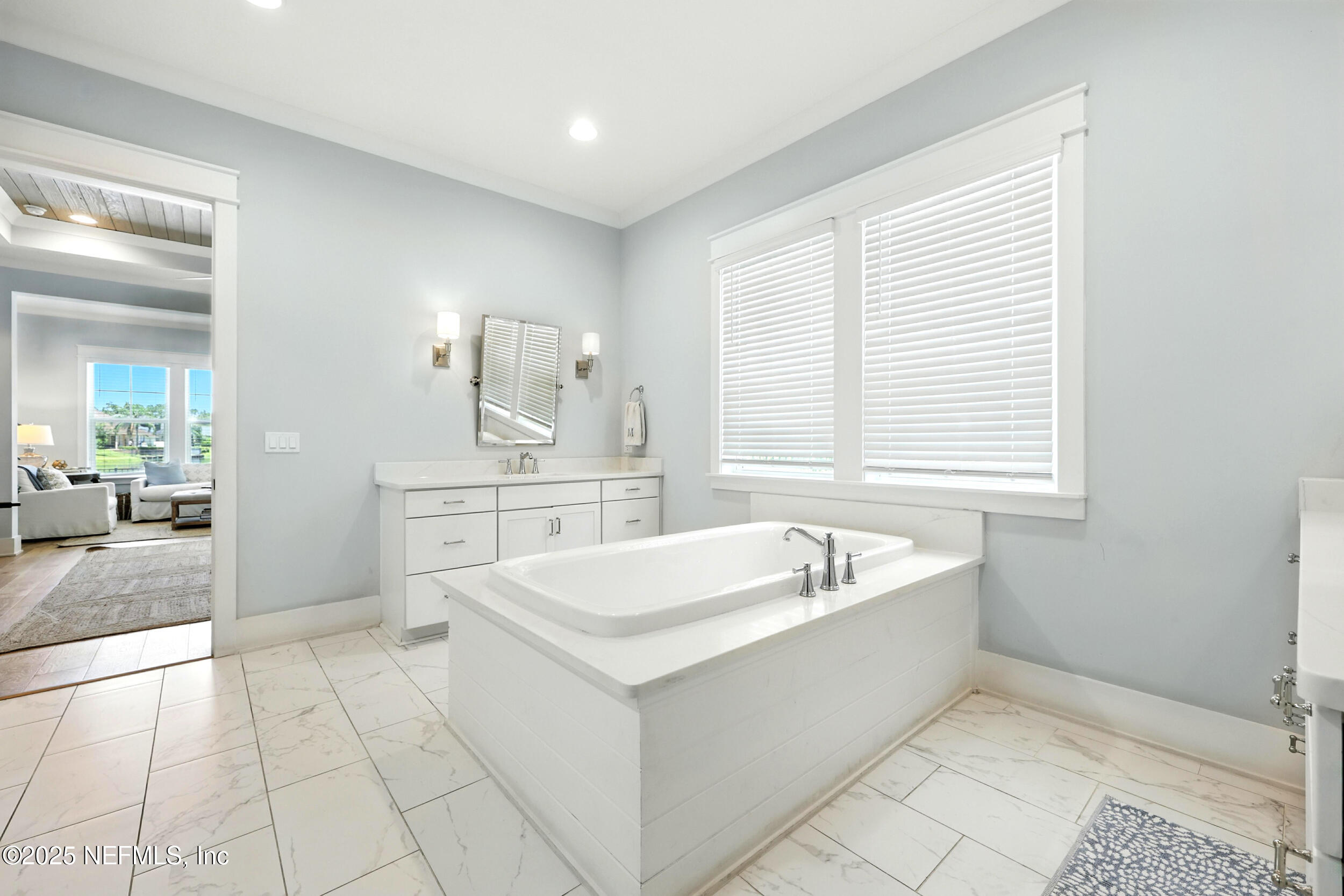 116 Palm Bay Court Ponte Vedra Beach, FL 32082 - Photo 24 of 60 a spacious bathroom with a tub sink and mirror
