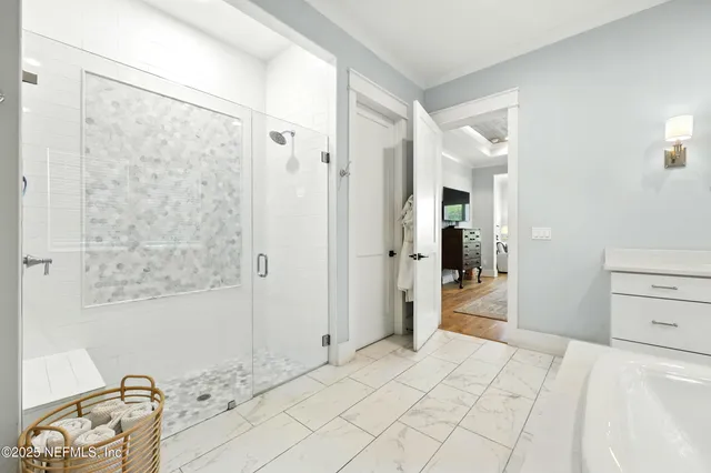 a bedroom with furniture and a wooden floor