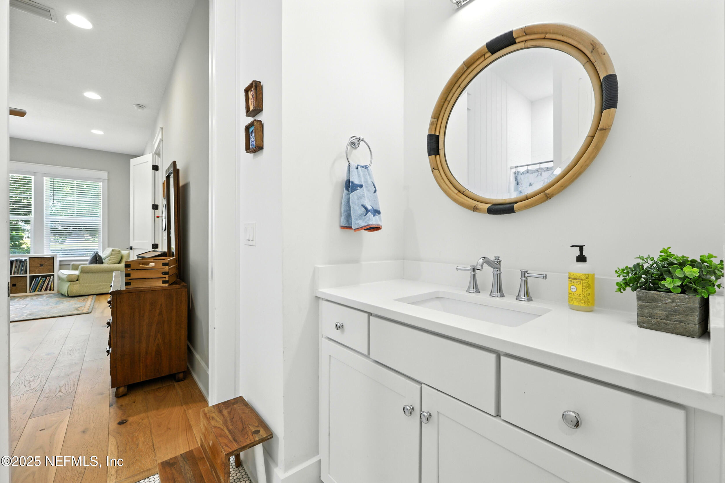 116 Palm Bay Court Ponte Vedra Beach, FL 32082 - Photo 30 of 60 a bathroom with a sink and a mirror