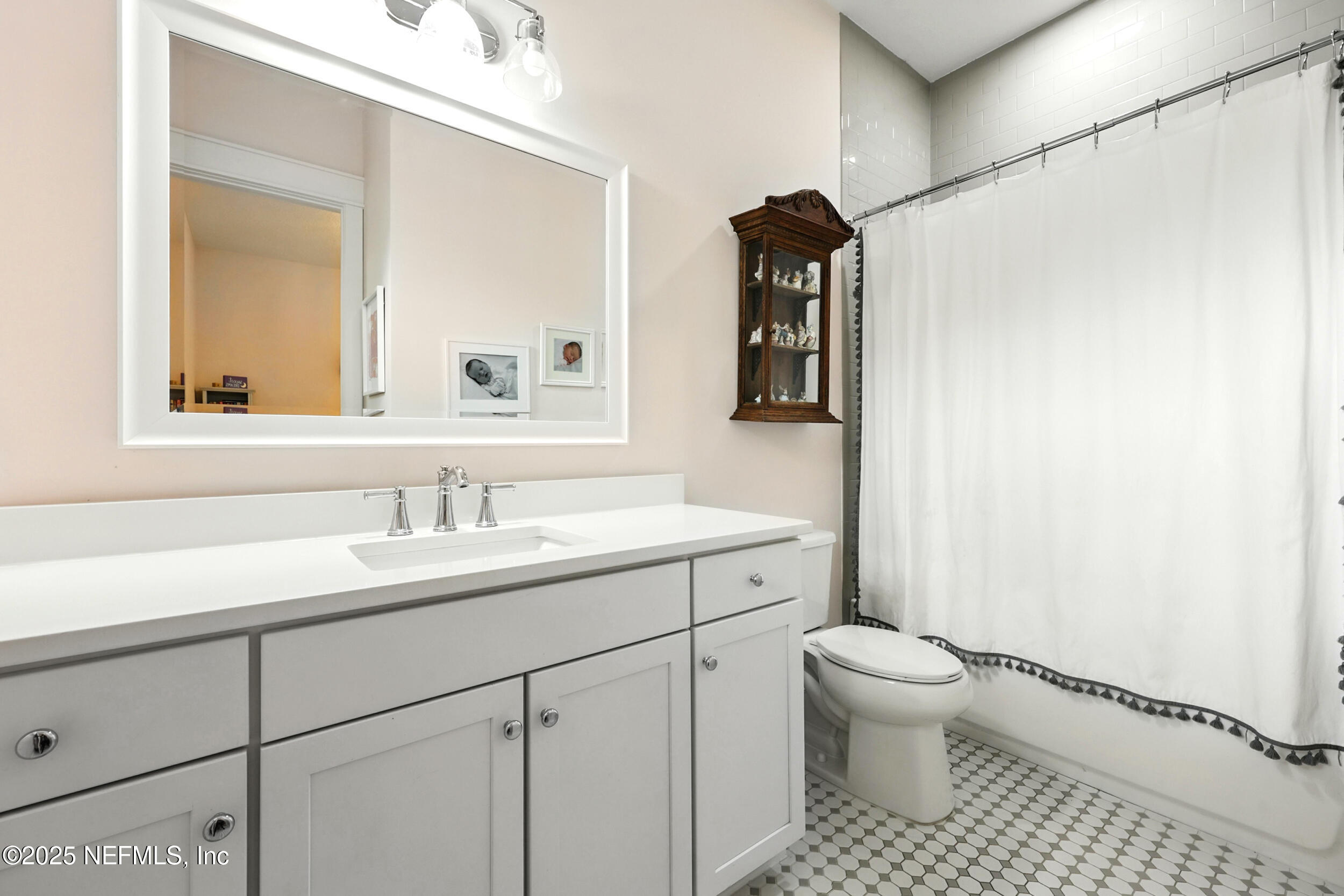 116 Palm Bay Court Ponte Vedra Beach, FL 32082 - Photo 33 of 60 a bathroom with a sink a toilet and a mirror