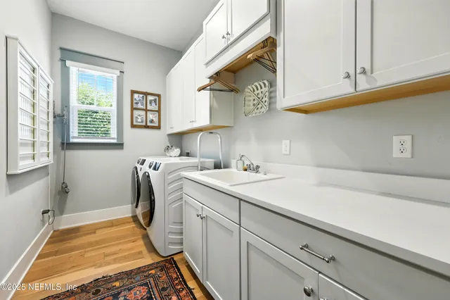 a view of backyard with a table and chairs