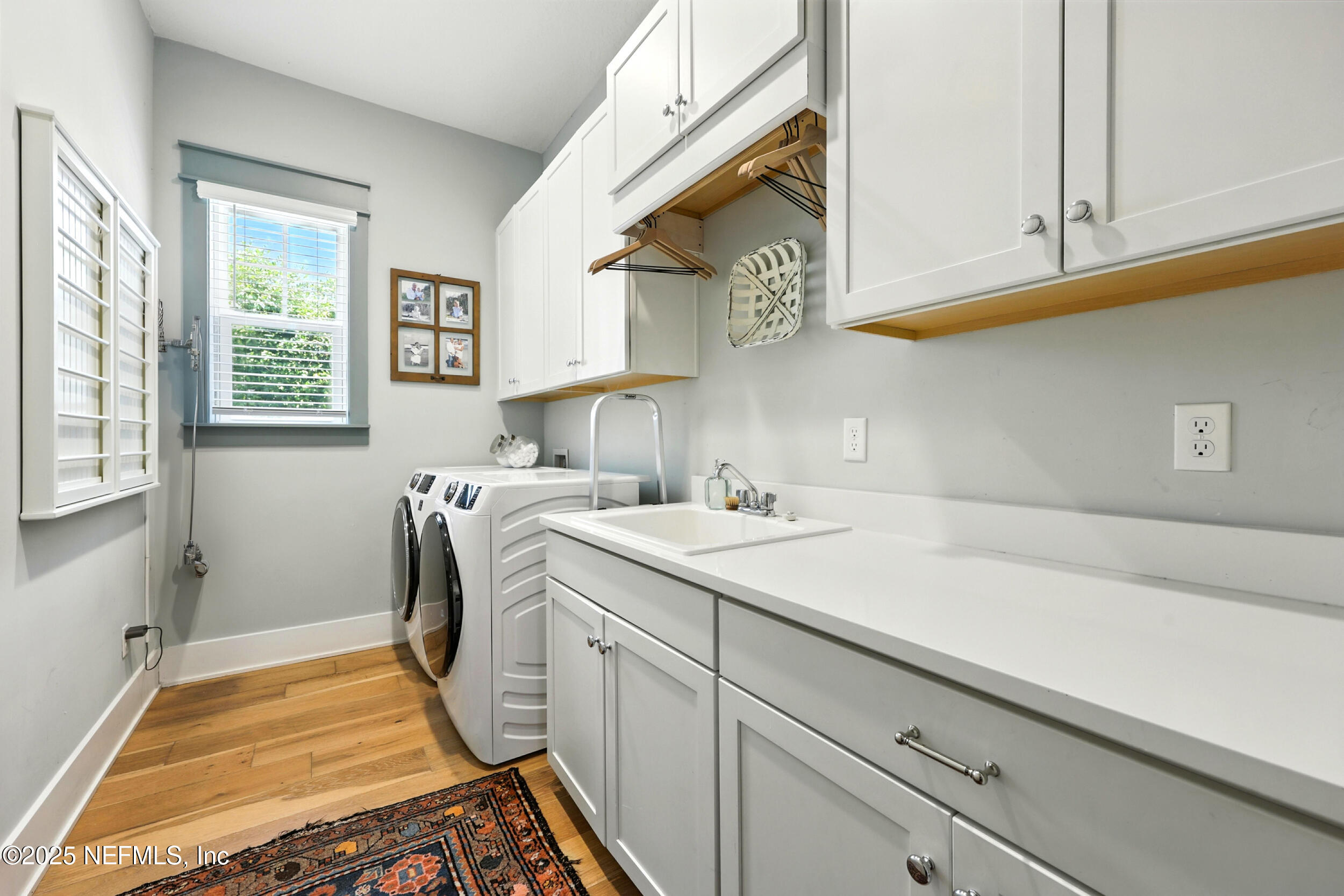 116 Palm Bay Court Ponte Vedra Beach, FL 32082 - Photo 38 of 60 a utility room with a sink a washer and dryer