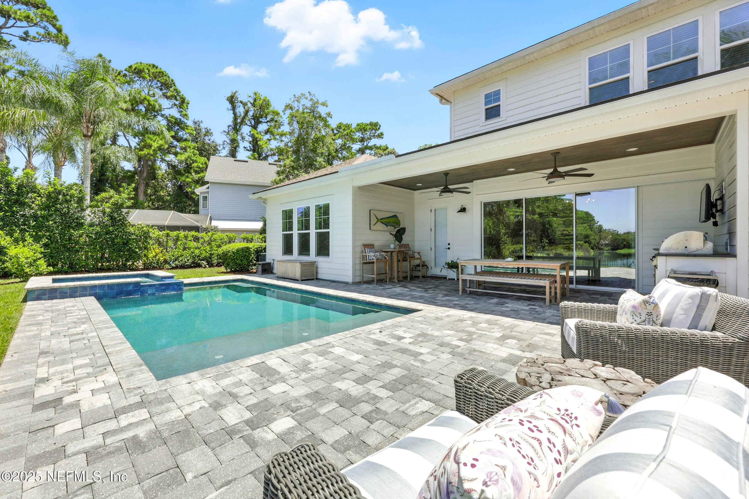 116 Palm Bay Court Ponte Vedra Beach, FL 32082 - Photo 43 of 60 a view of a house with swimming pool and furniture