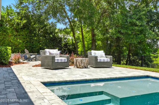 an aerial view of a house with a yard and garden