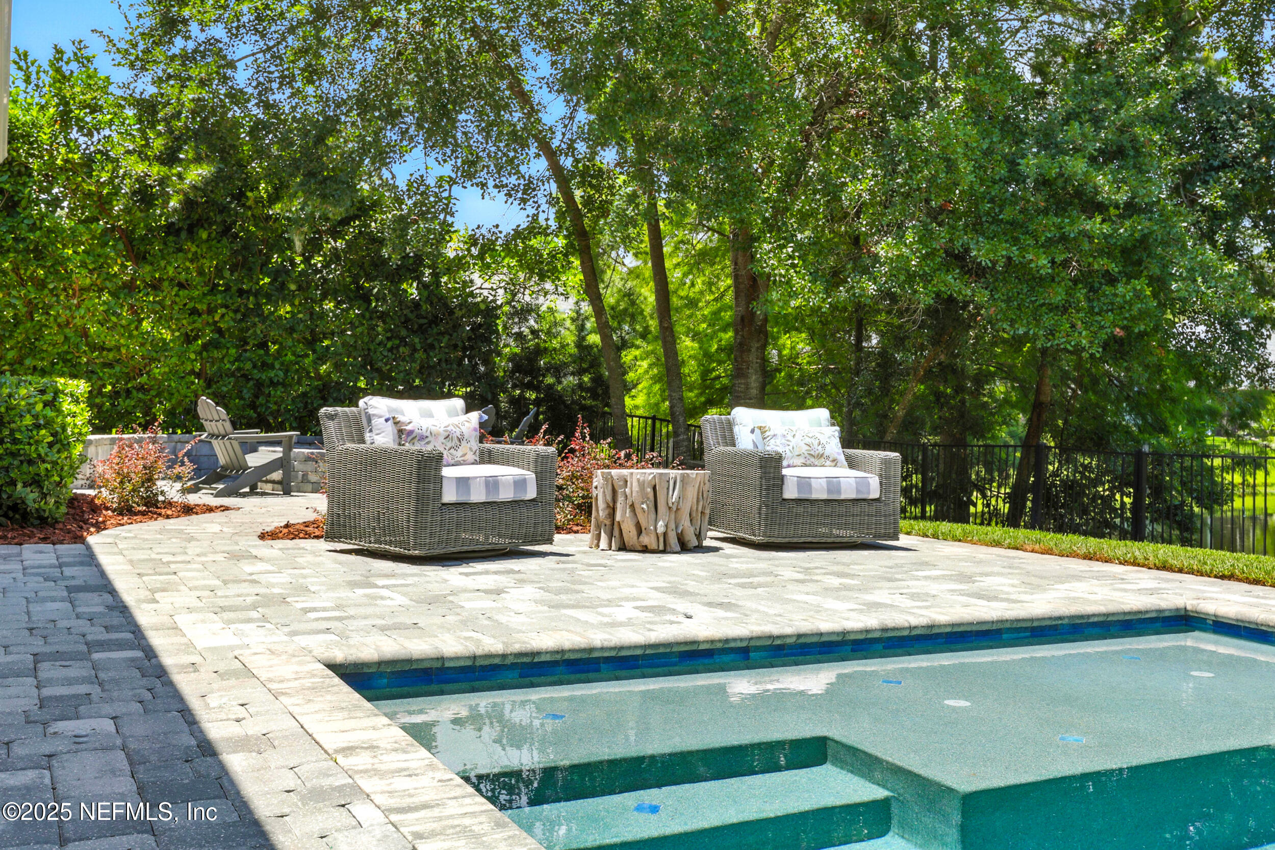 116 Palm Bay Court Ponte Vedra Beach, FL 32082 - Photo 46 of 60 a view of backyard with a table and chairs