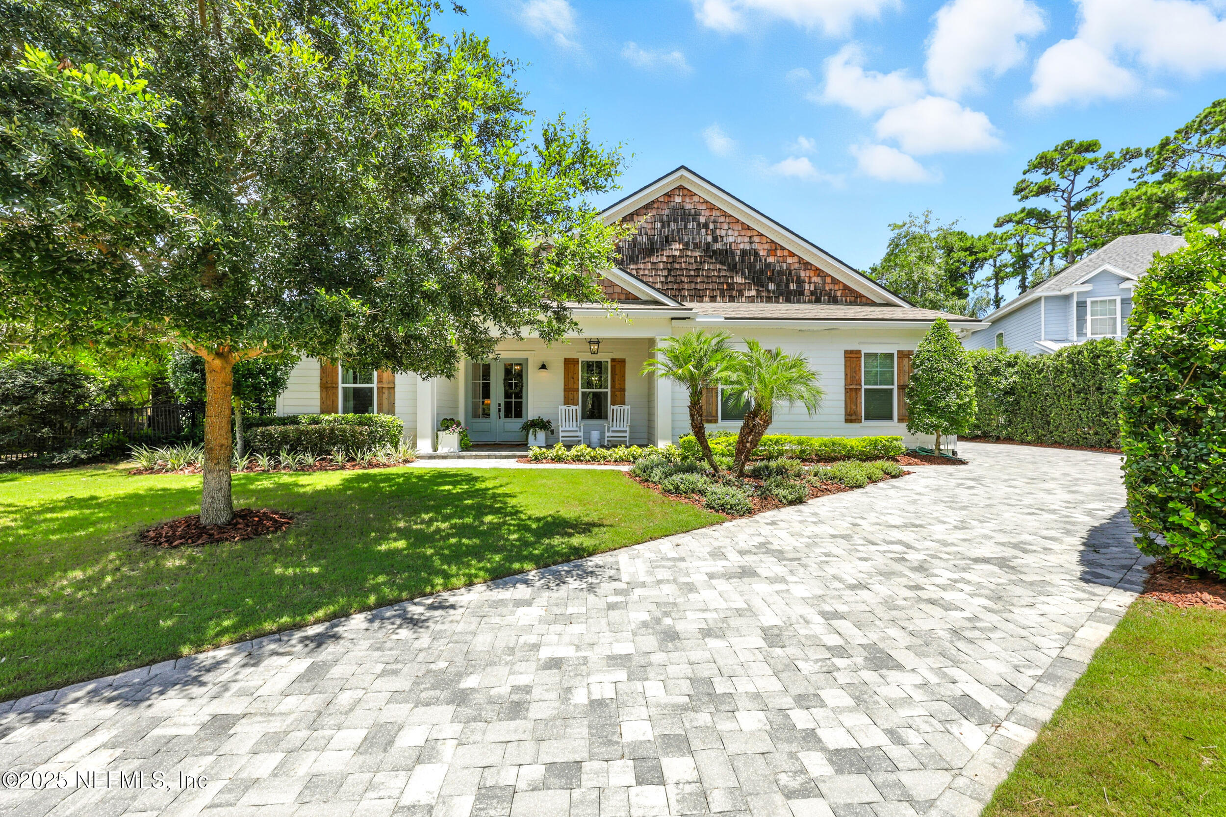 116 Palm Bay Court Ponte Vedra Beach, FL 32082 - Photo 49 of 60 a front view of a house with a yard