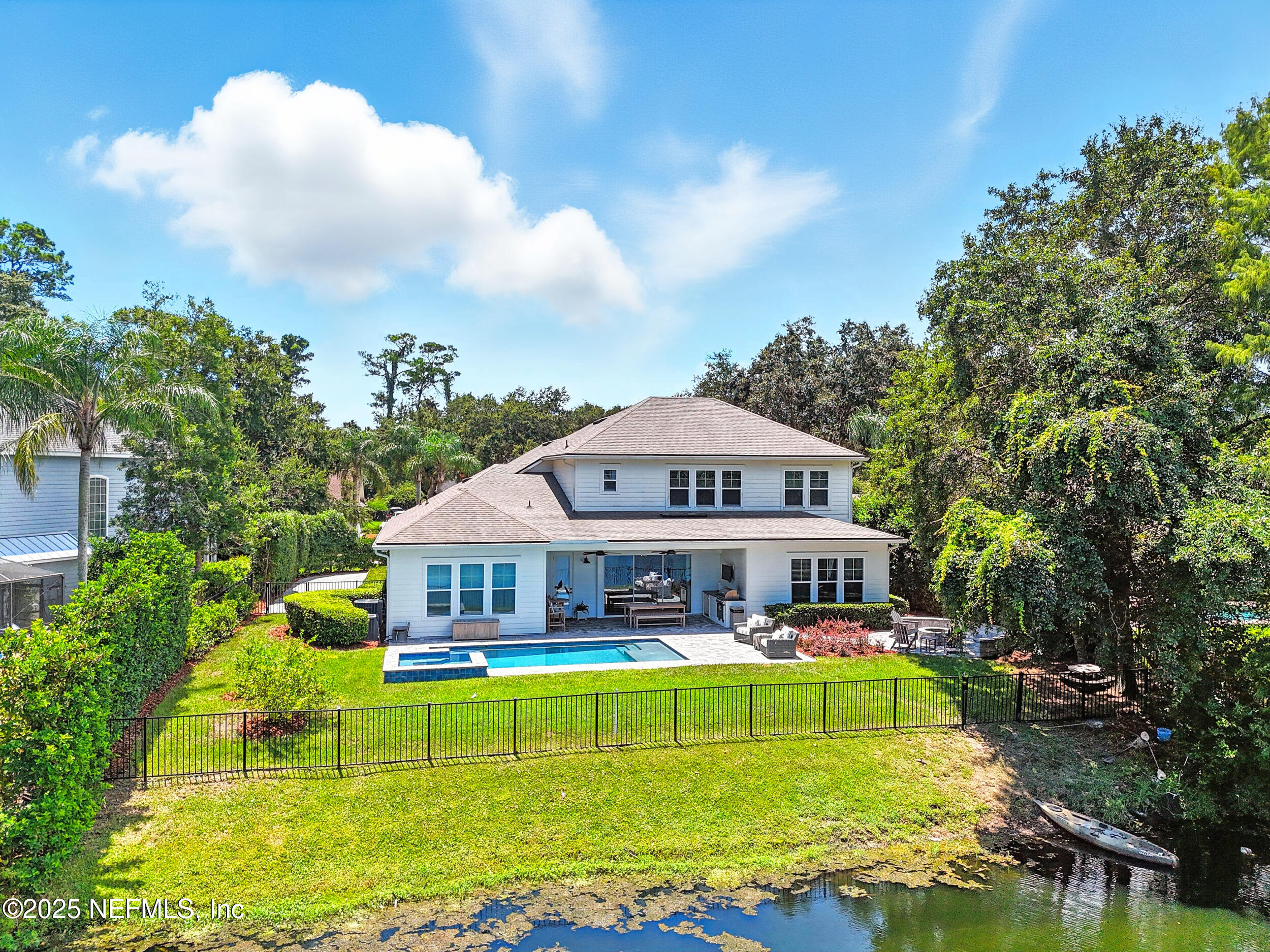 116 Palm Bay Court Ponte Vedra Beach, FL 32082 - Photo 57 of 60 a view of a big house with a big yard and large trees
