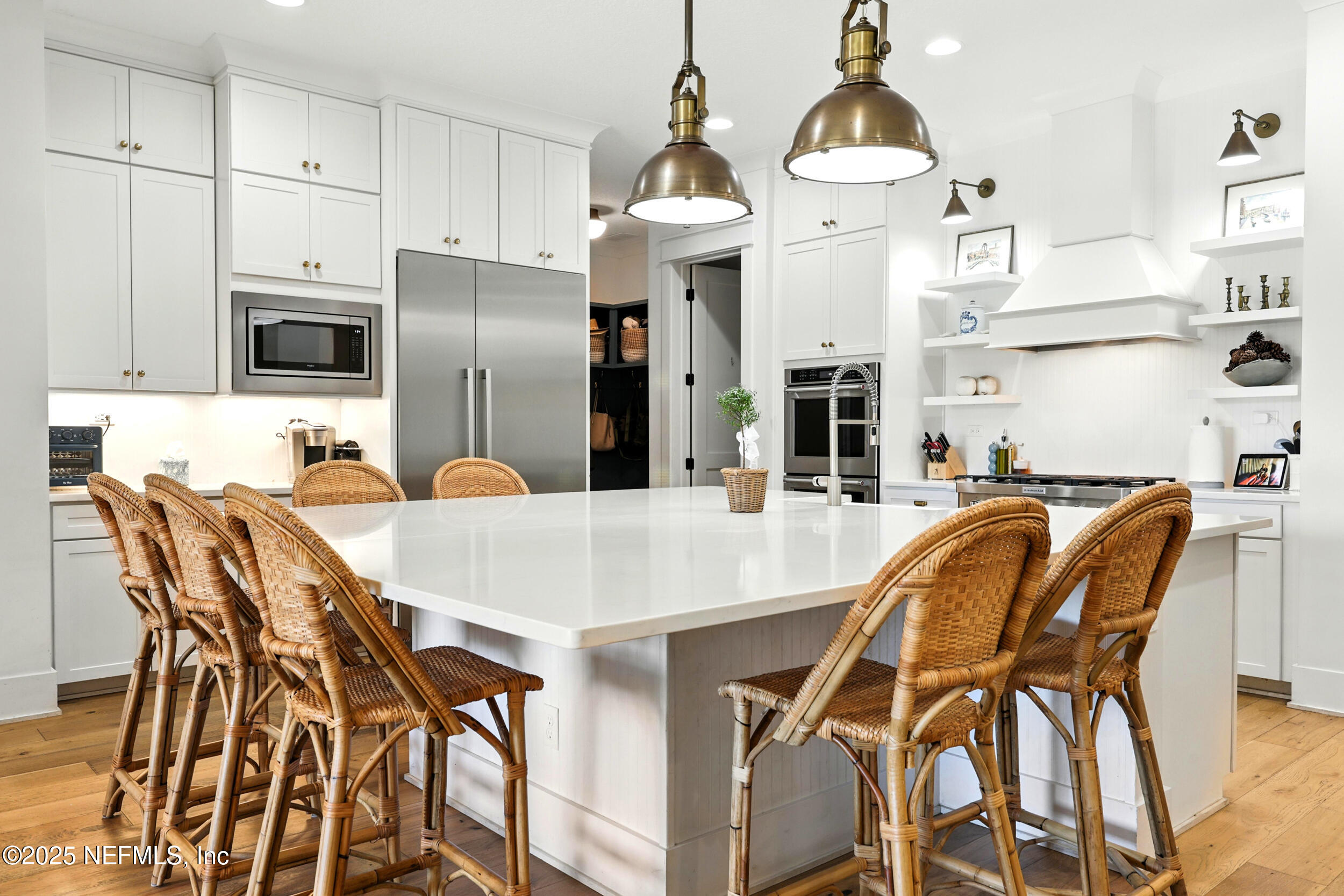 116 Palm Bay Court Ponte Vedra Beach, FL 32082 - Photo 10 of 60 a kitchen with stainless steel appliances kitchen island granite countertop a dining table chairs and granite counter tops