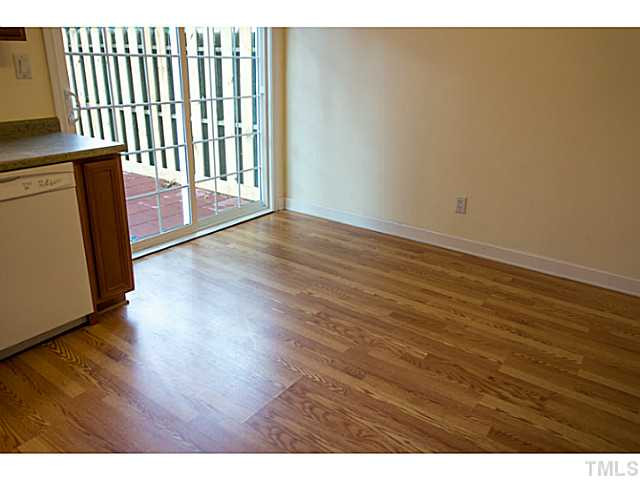5814 Shady Grove Circle Raleigh, NC 27609 - Photo 8 of 15 a view of a hallway with wooden floor