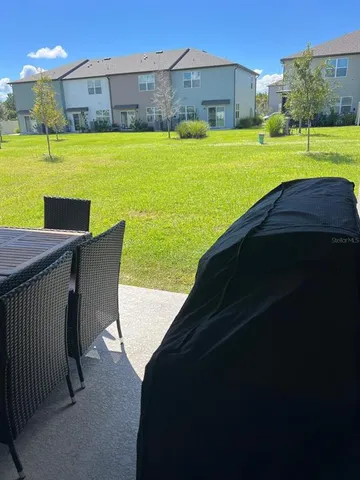 a view of a swimming pool with a yard