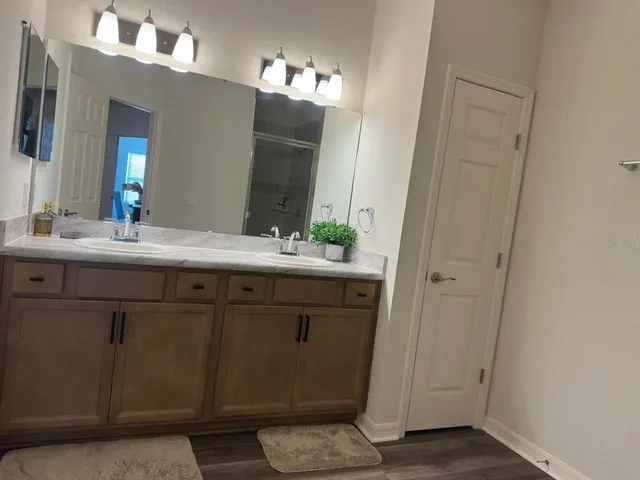 a bathroom with a sink and a mirror