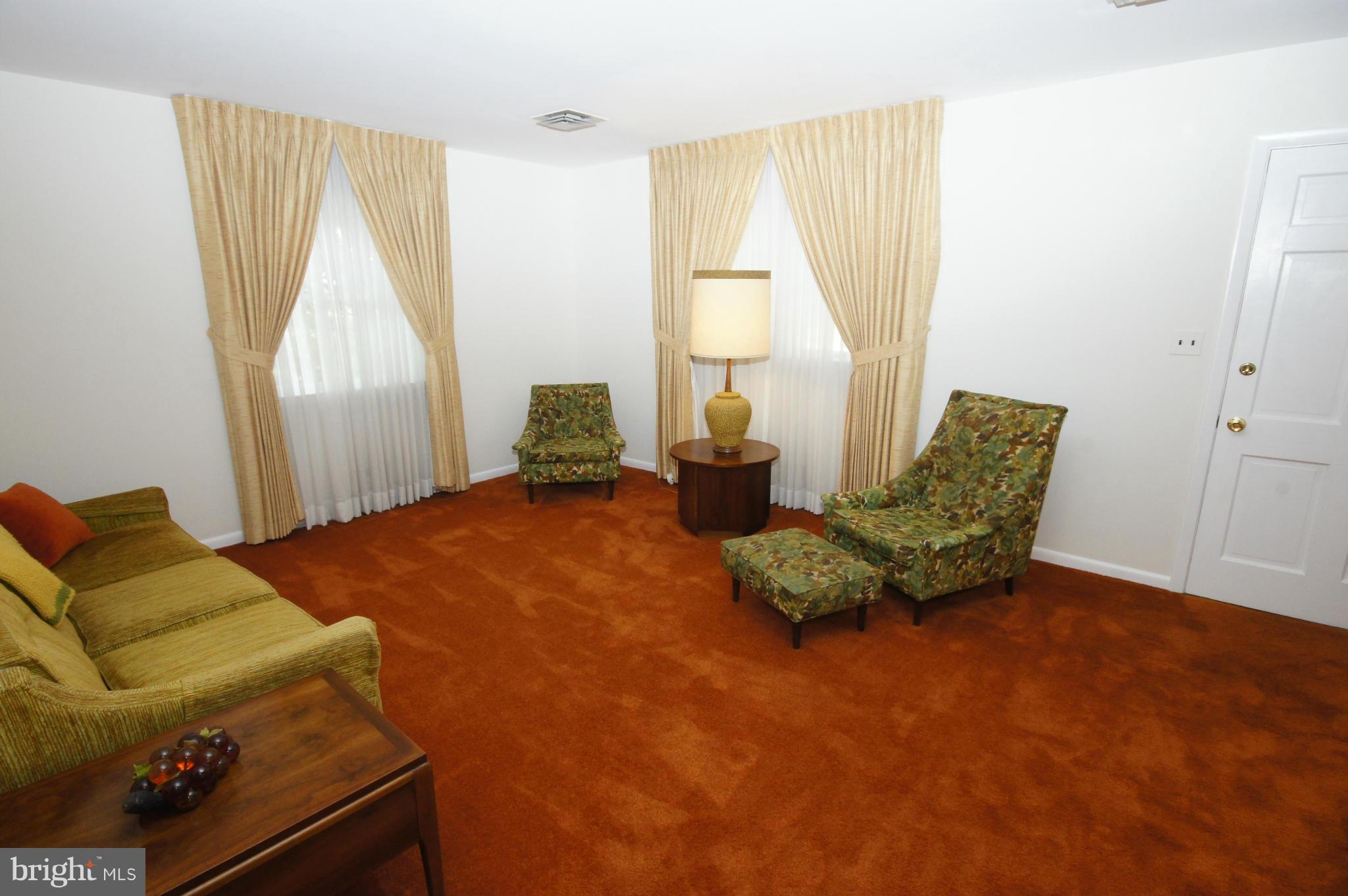 6202 Gilston Park Road Baltimore, MD 21228 - Photo 2 of 21 a bedroom with a bed and a window