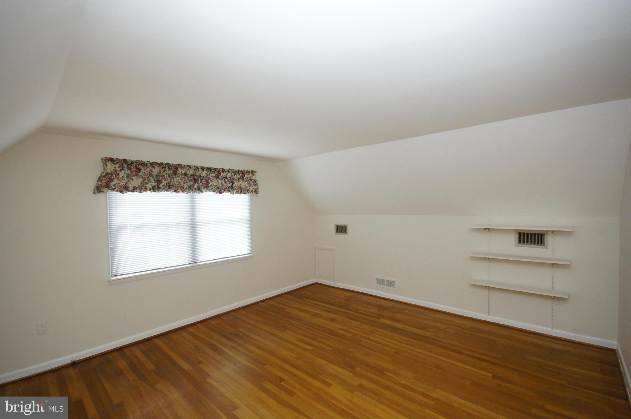 6202 Gilston Park Road Baltimore, MD 21228 - Photo 12 of 21 an empty room with a window
