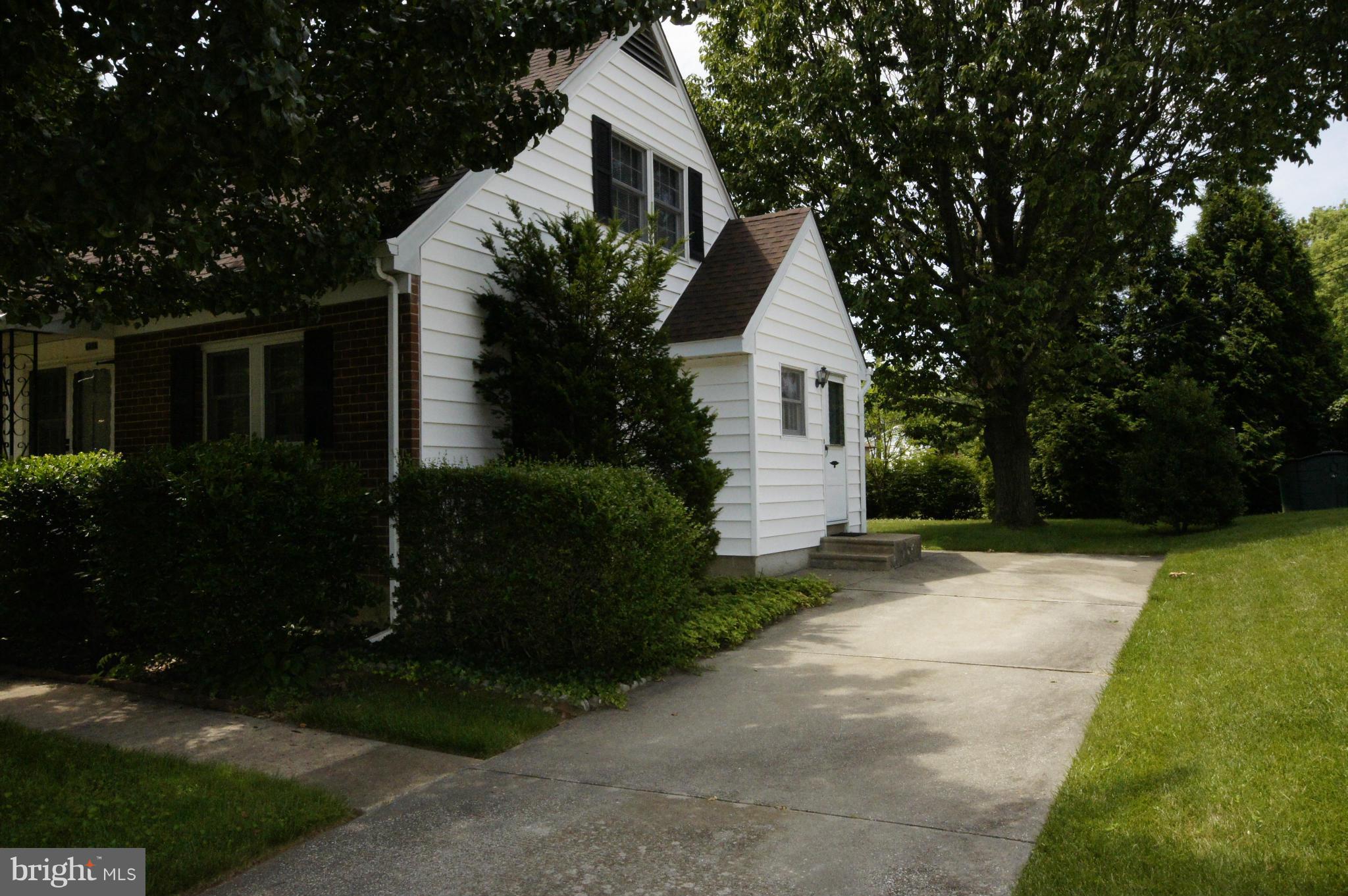 6202 Gilston Park Road Baltimore, MD 21228 - Photo 17 of 21 a front view of house with a garden