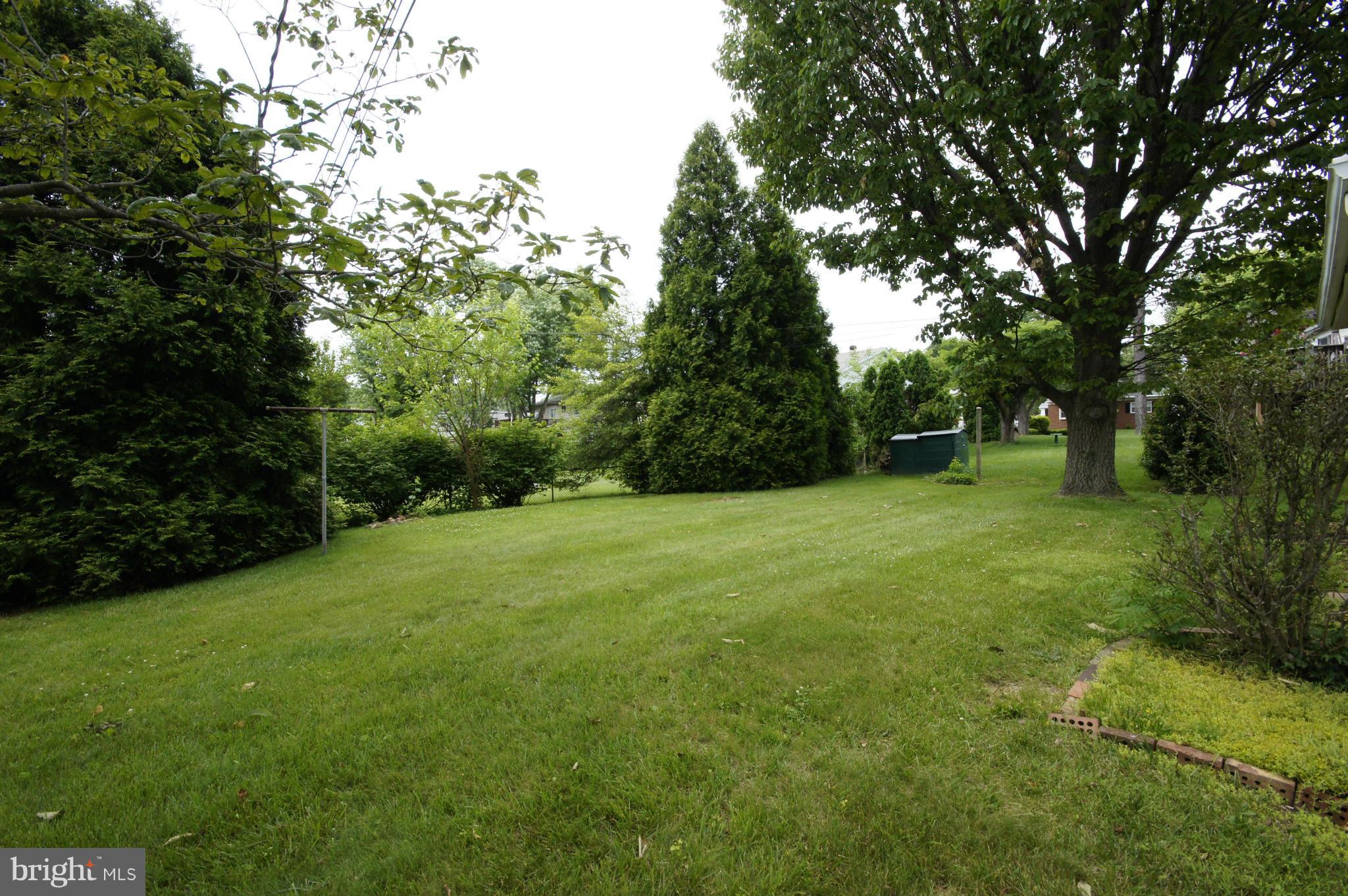 6202 Gilston Park Road Baltimore, MD 21228 - Photo 18 of 21 a view of a field of grass and trees